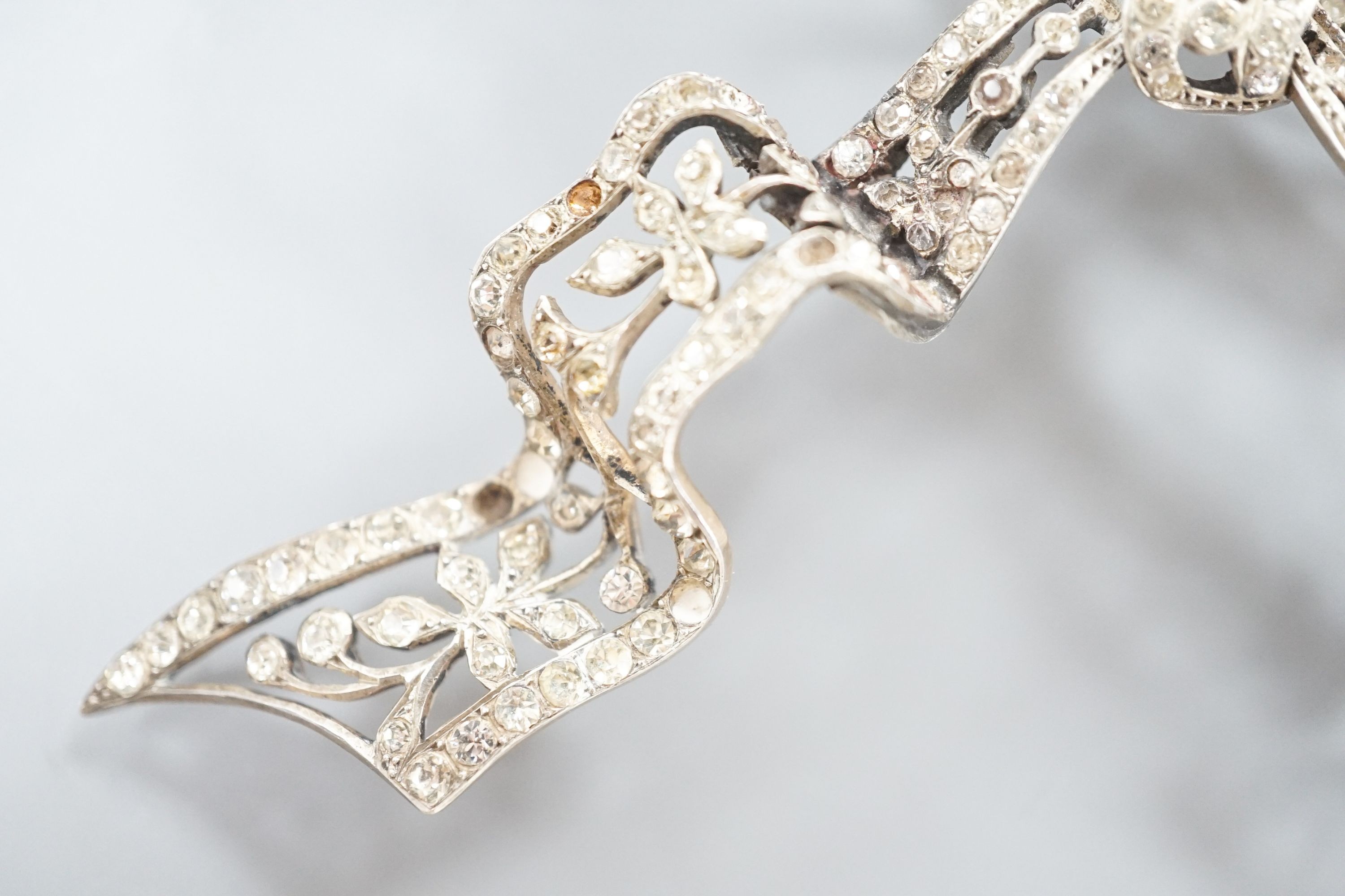 A sterling and paste set large ribbon bow brooch, width 95mm.